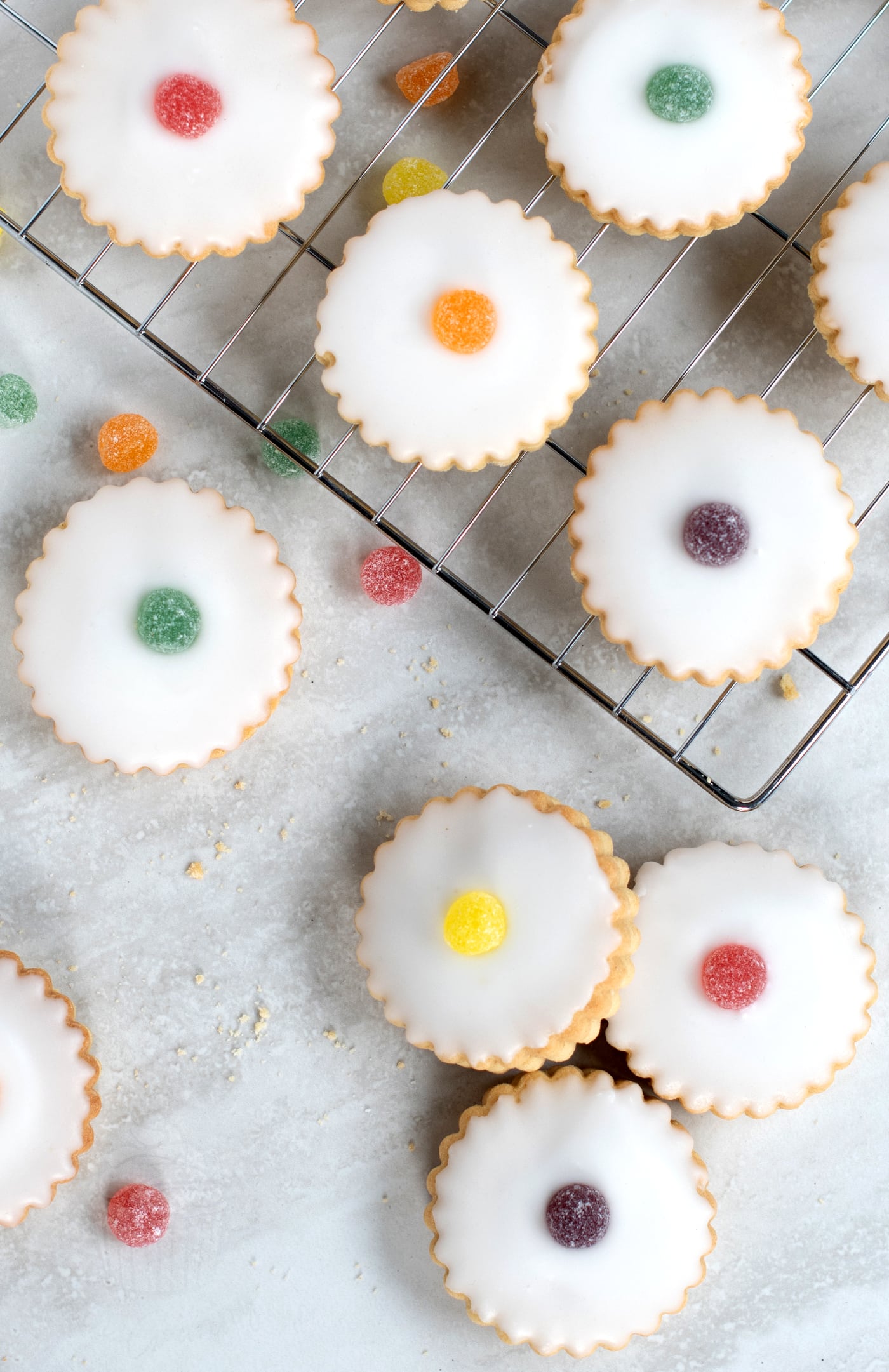 Empire Biscuits recipe from Baking with Granny. Traditional Scottish cookies, sandwiched with strawberry or raspberry jam and topped with icing and a gum drop.