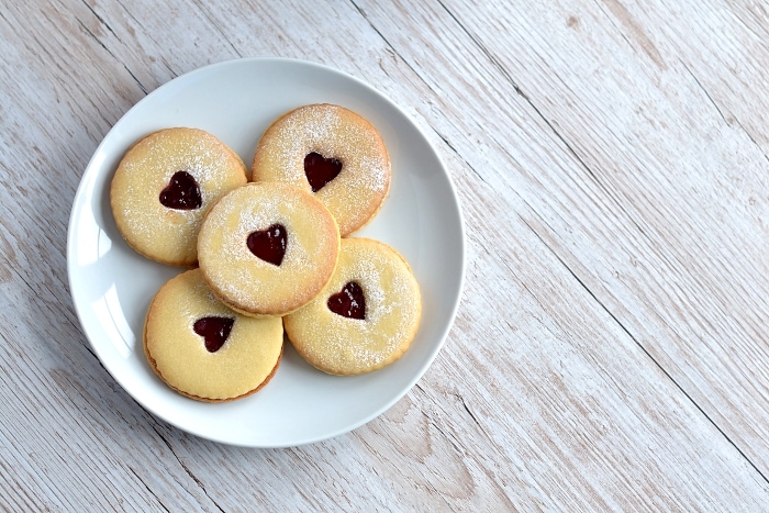 Jammy Dodgers recipe from Baking with Granny. Classic British biscuit. Melt-in-the-mouth, sandwiched with jam, and a little heart middle.