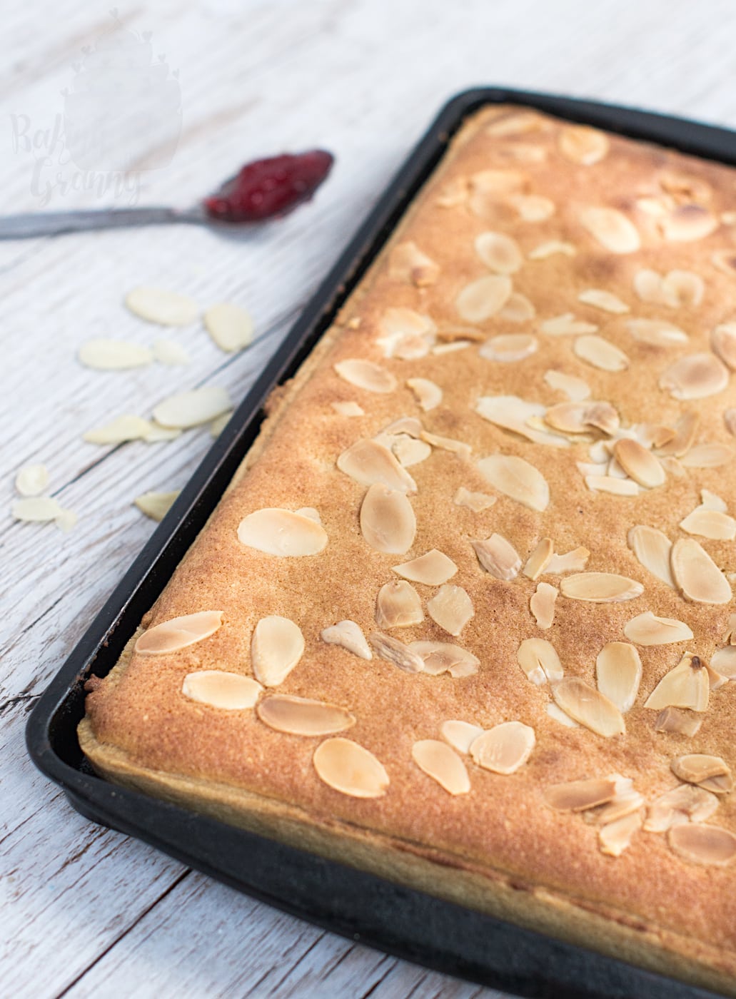 Almond Slice traybake, topped with flaked almonds.