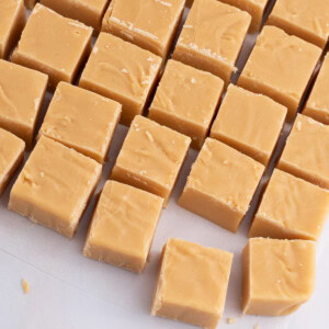 Rows of homemade Scottish tablet squares laid out on baking paper, from a traditional Scottish recipe.