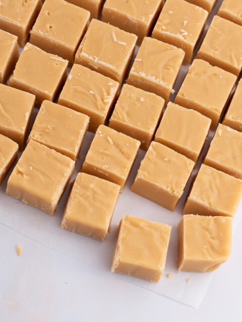 Rows of homemade Scottish tablet squares laid out on baking paper, from a traditional Scottish recipe.