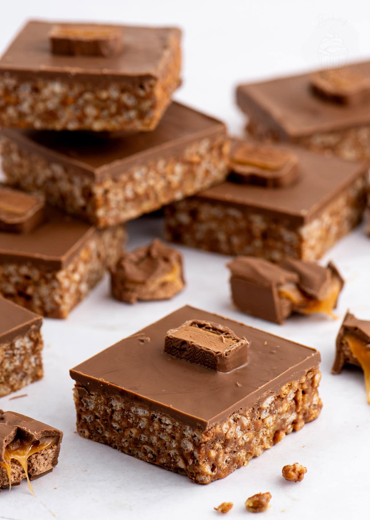 Homemade Mars Bar Slice with a chocolate rice crispy base, topped with smooth milk chocolate and pieces of Mars Bar.