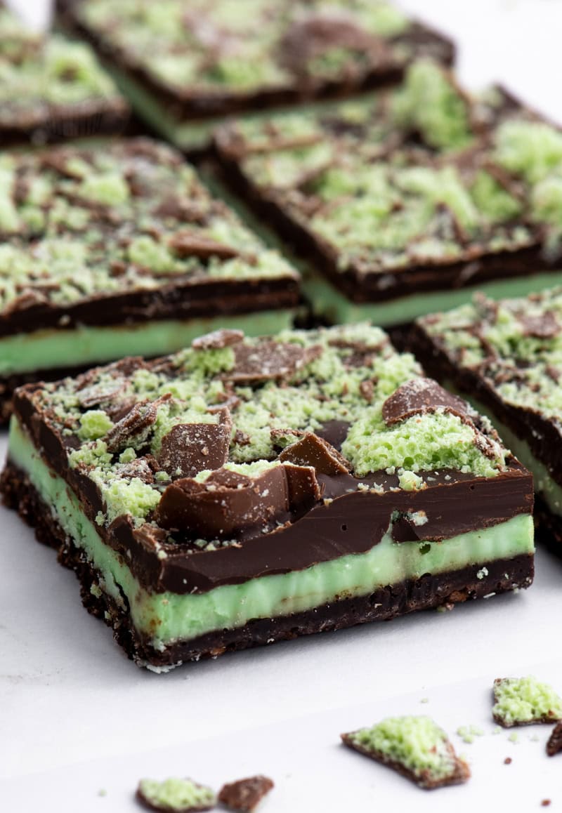 Close-up of Peppermint Slice square topped with chocolate and crushed Mint Aero pieces.