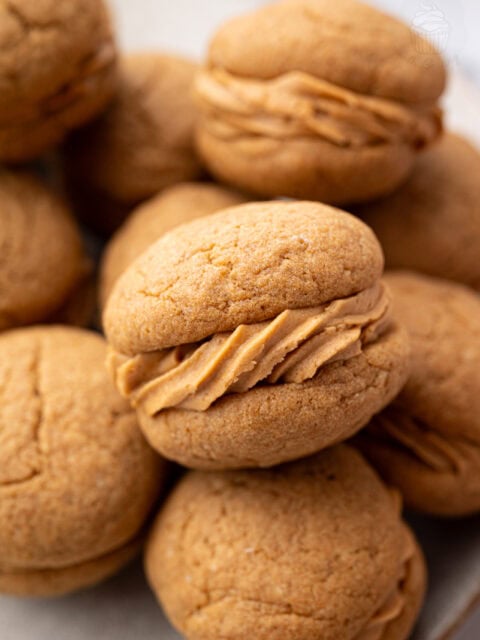 Close-up of coffee kisses biscuits showing the soft coffee buttercream filling.