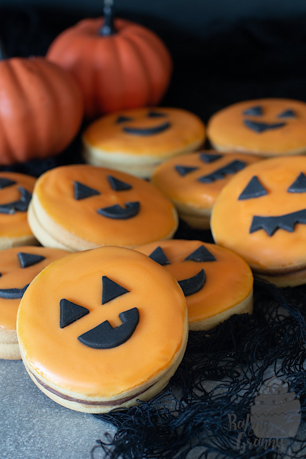 Pumpkin cookies. Empire biscuits with pumpkin faces.
