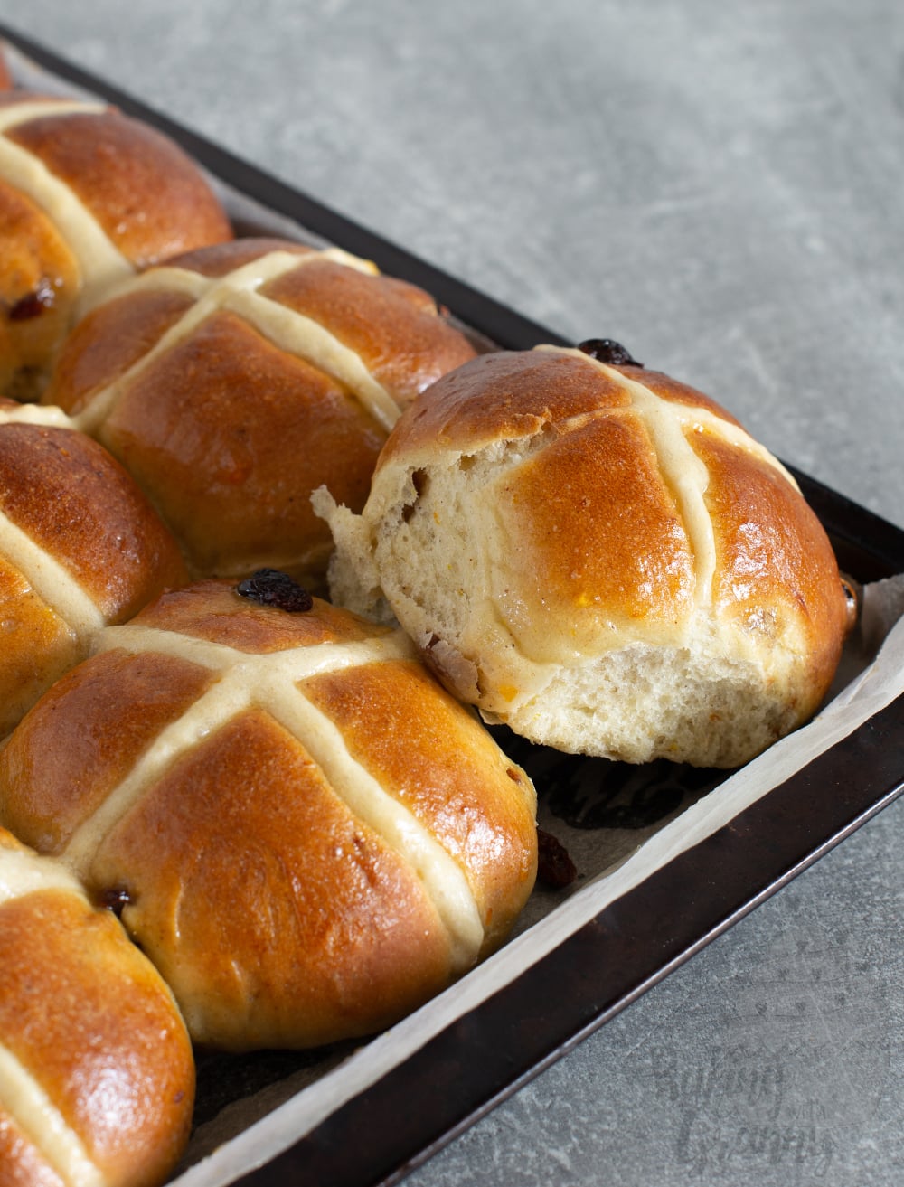 Hot Cross Buns recipe. Freshly made hot cross buns, made with yeast, dried fruit and orange.