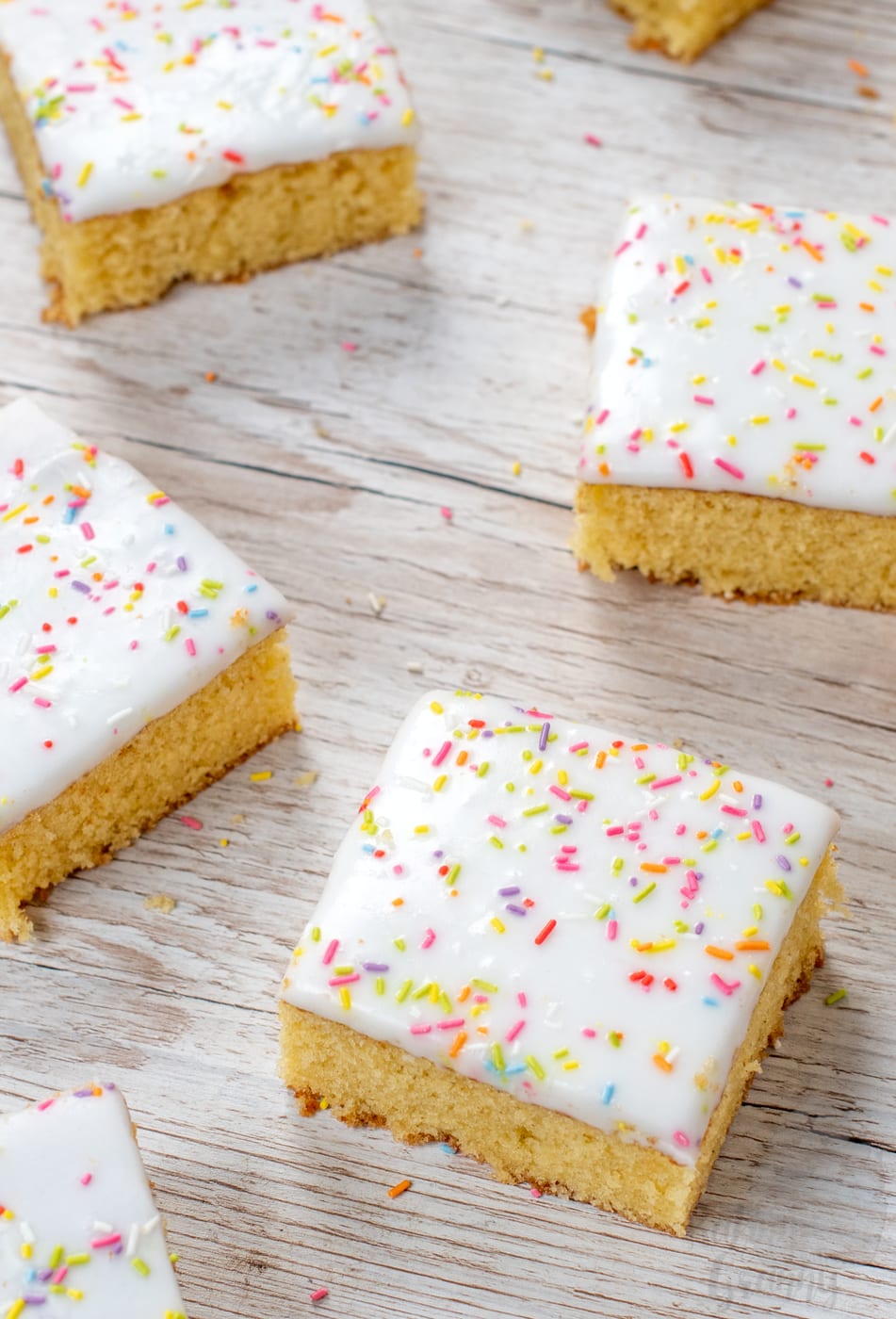 School Cake recipe by Baking with Granny. Sponge cake with white icing and rainbow sprinkles.