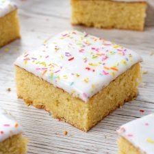 School Cake recipe by Baking with Granny. Sponge cake with white icing and rainbow sprinkles.