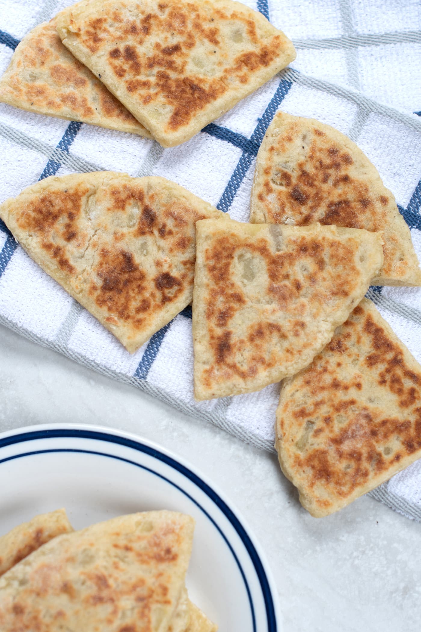 Tatty Scones on a blue and white tea towel.