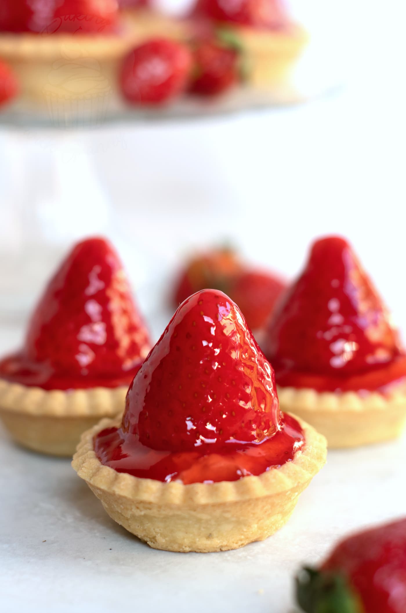 Home made strawberry tarts, made in Scotland. Golden pastry base, with cream filling and strawberry on top. Finished with sticky strawberry sauce.