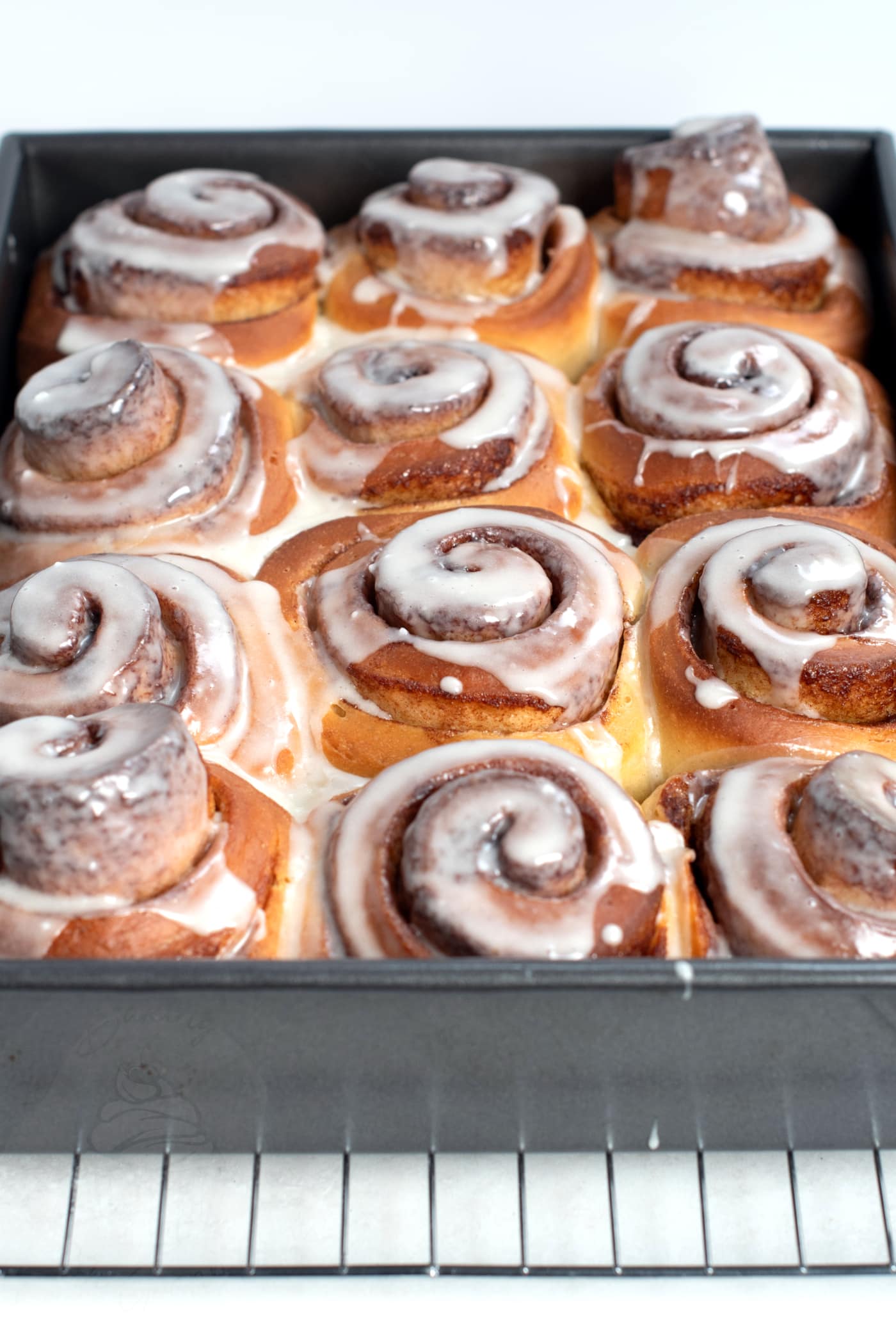 Cinnamon Buns recipe from the UK. Homemade Cinnamon Rolls, made with fresh dough, cinnamon filling and sweet icing.