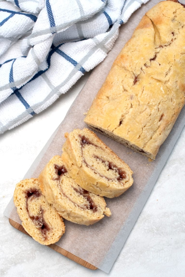 Jam Roly Poly recipe from Baking with Granny. Delicious golden roll, made with traditional suet dough. Filled with raspberry jam. Served in slices.