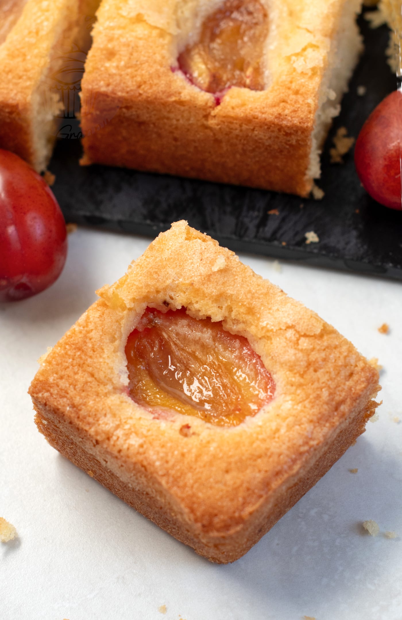 UK recipe for easy Plum Cake. Vanilla sponge with fresh juicy plums.
