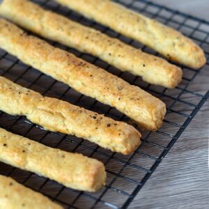 Homemade cheese breadsticks baked until golden.