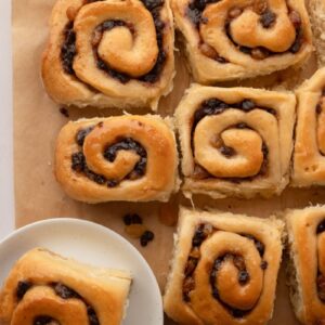 Sticky glazed Chelsea buns filled with currants, sultanas and mixed spice.