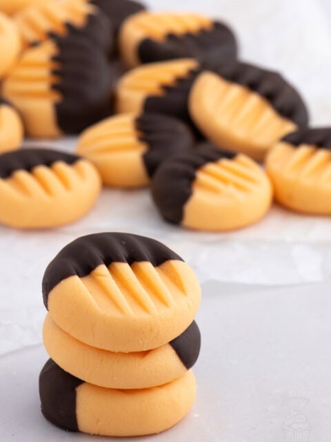 Stack of homemade orange creams dipped in dark chocolate – festive treat or edible Christmas gift.