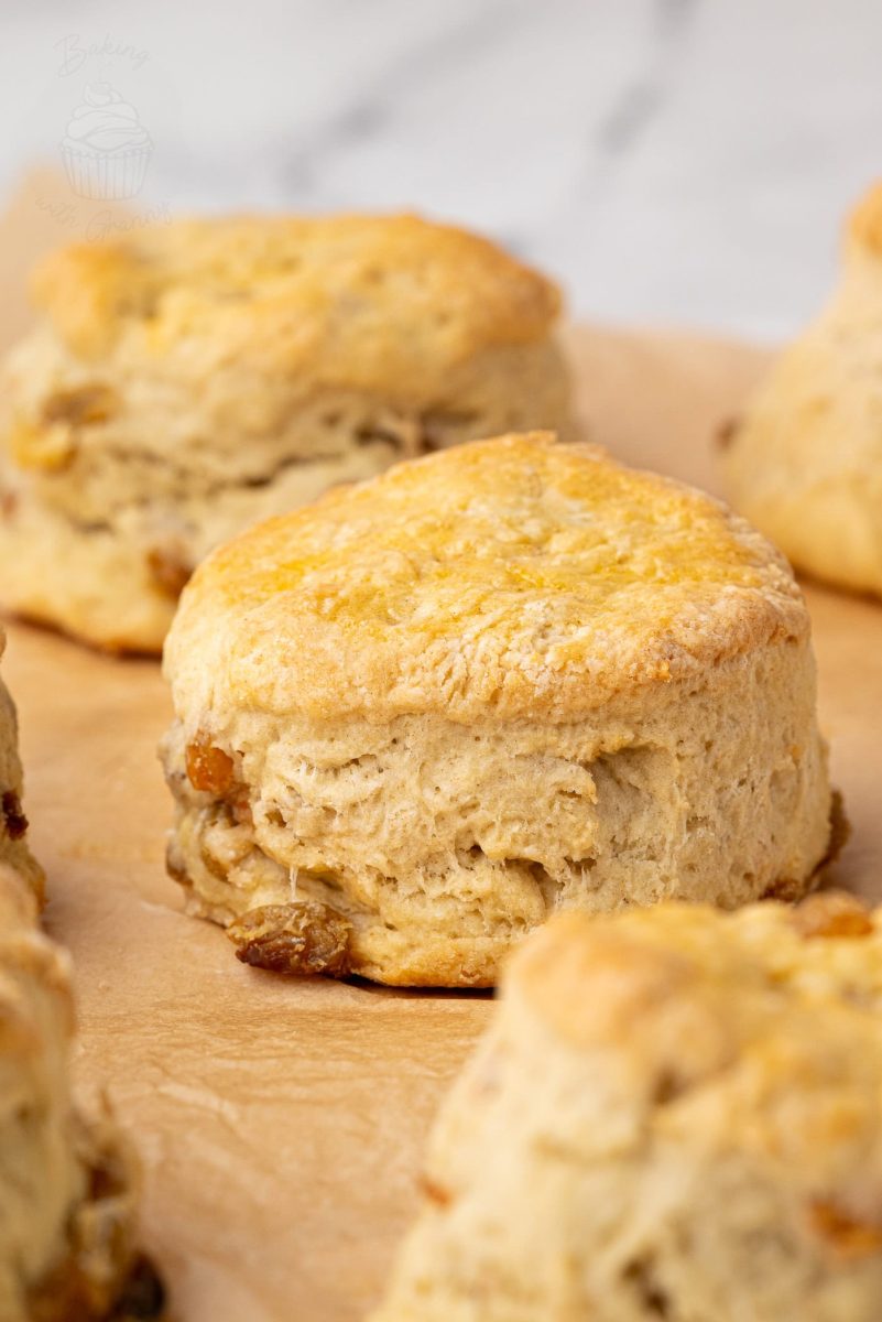 Fruit Scones Close-up of a golden brown home baked Fruit Scones, fresh from the oven and cooling on baking parchment.